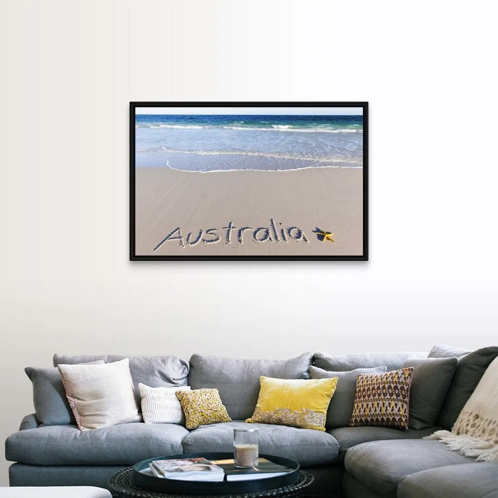 "Australia written on a sandy beach with a yellow starfish" Black Float Frame Canvas Art