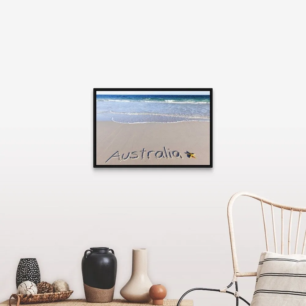"Australia written on a sandy beach with a yellow starfish" Black Float Frame Canvas Art
